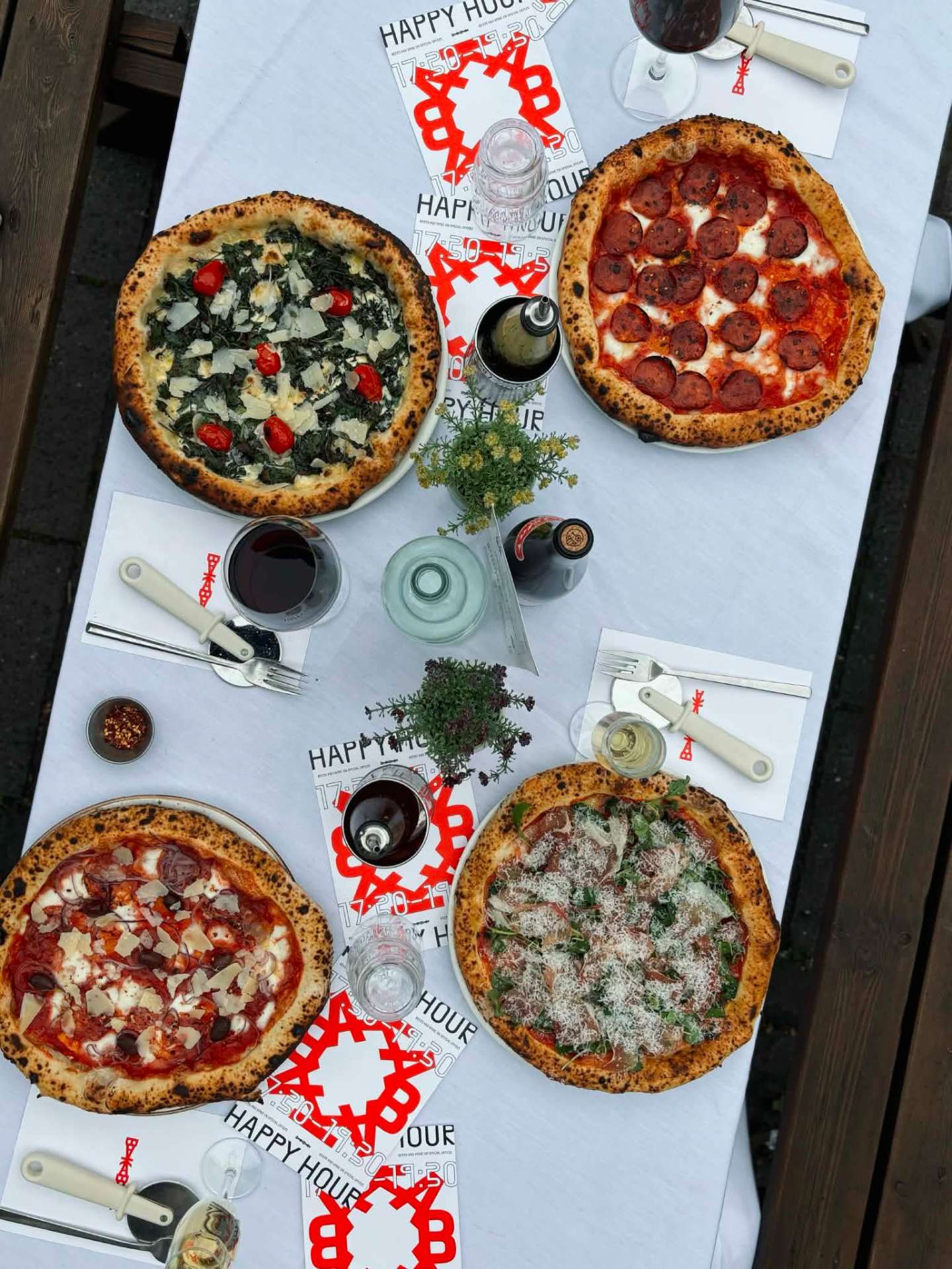 Pizzas spread across the table