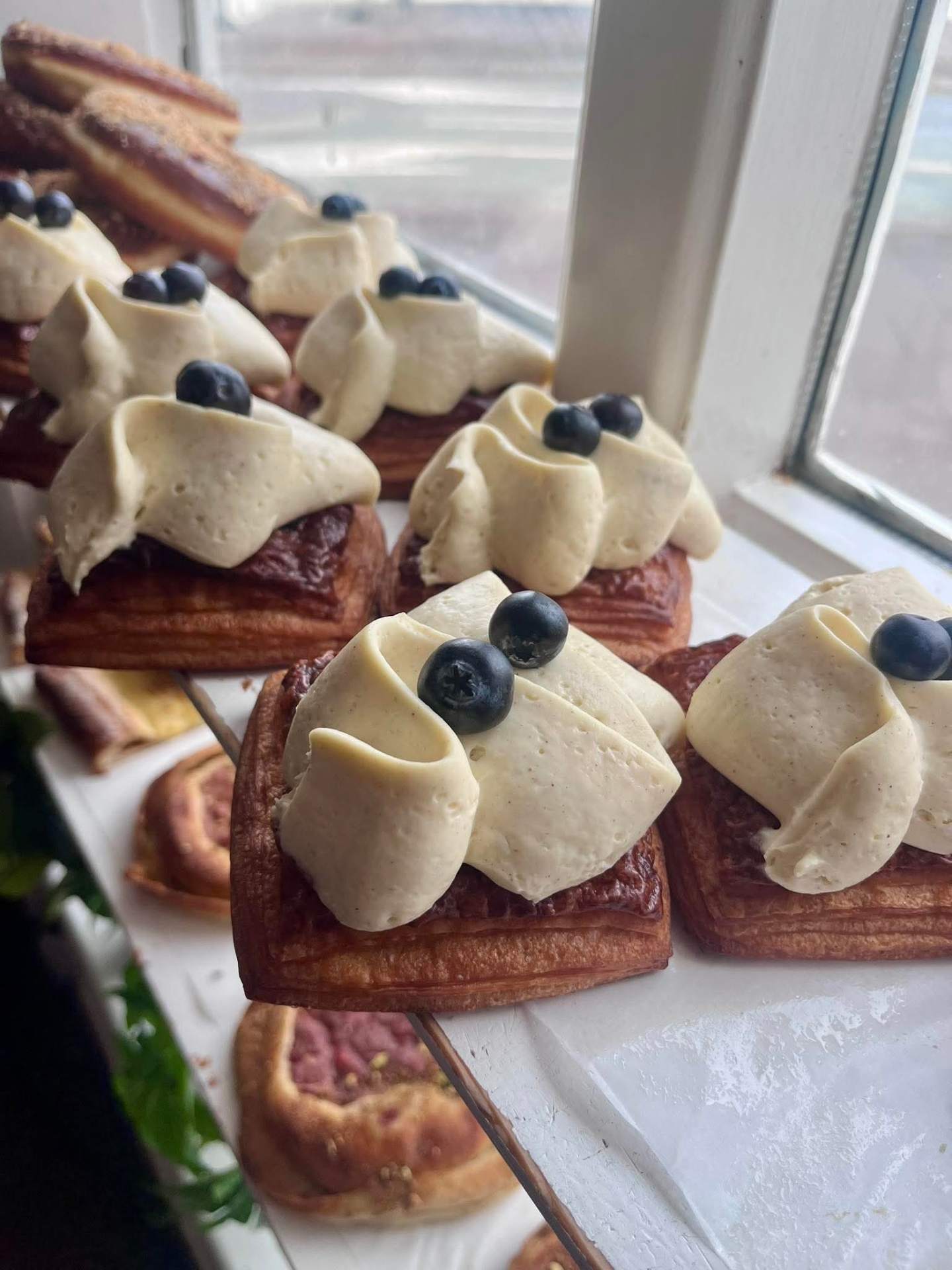 Cream pastries with blueberries
