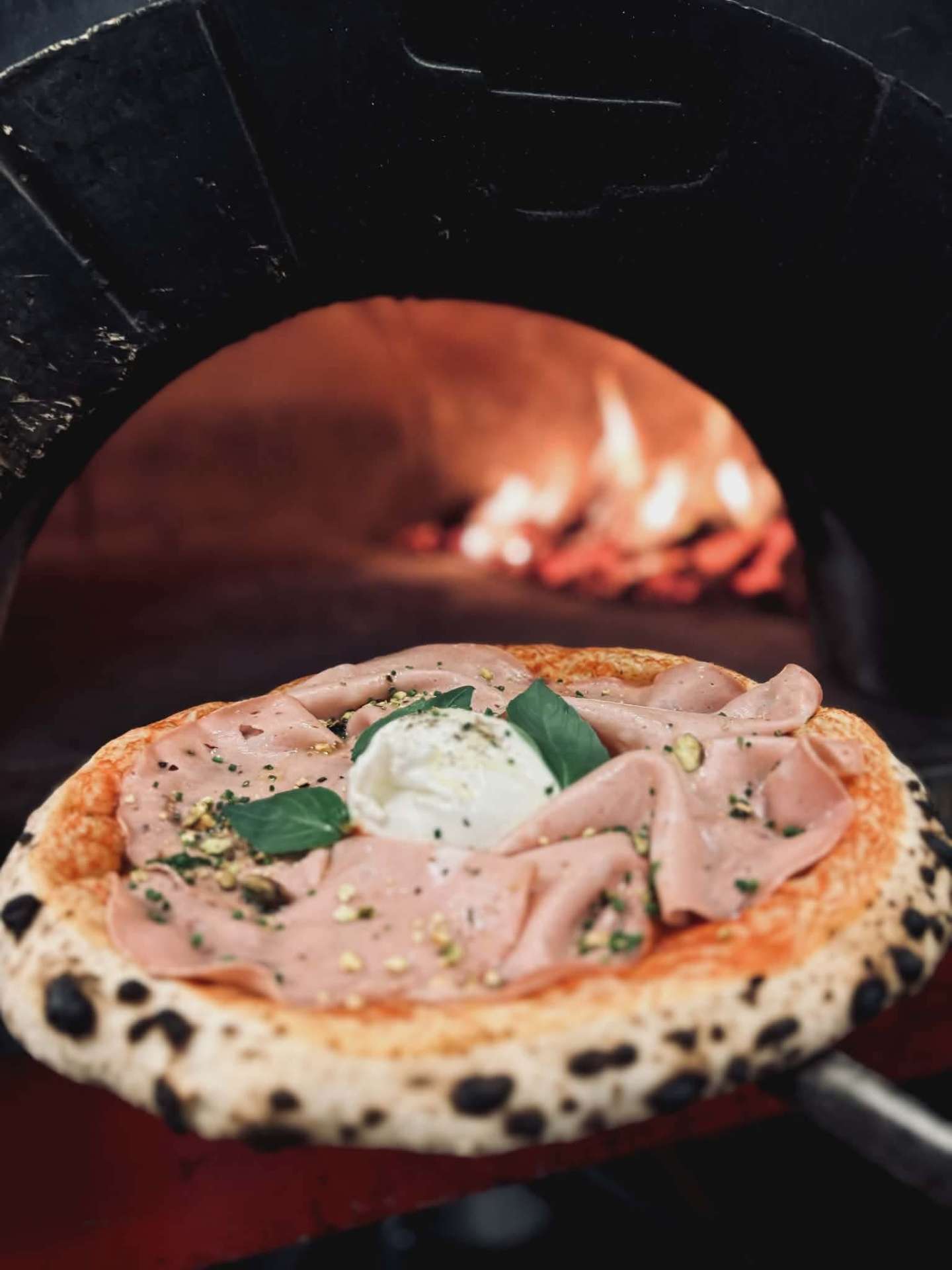 Mortadella pizza from the wood oven